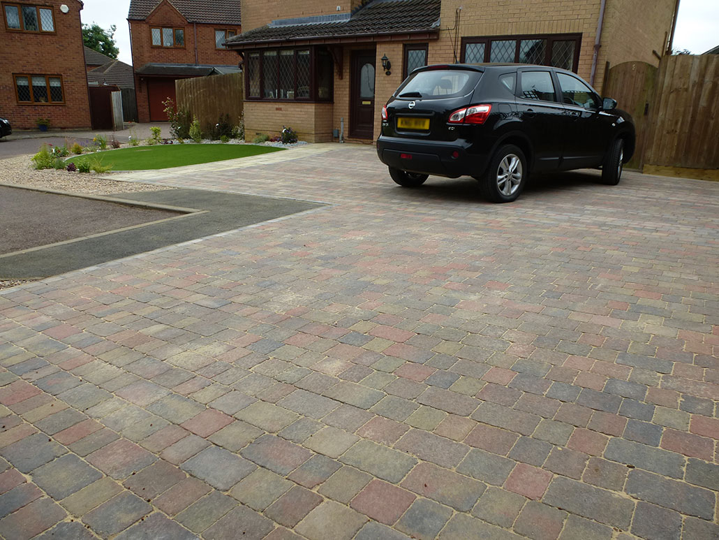 coloured driveway with planting area